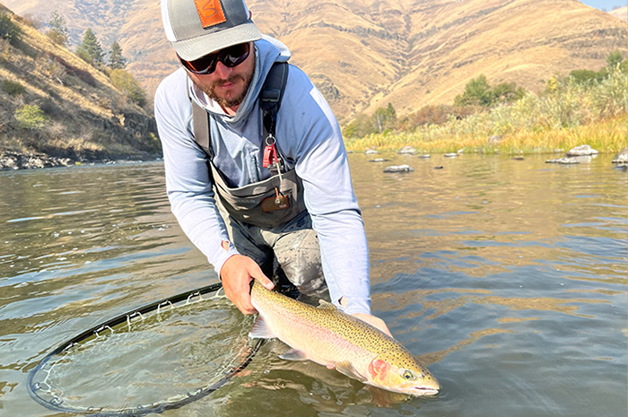 Kenyon releasing a Grande Ronde steelhead on a fine fall day.