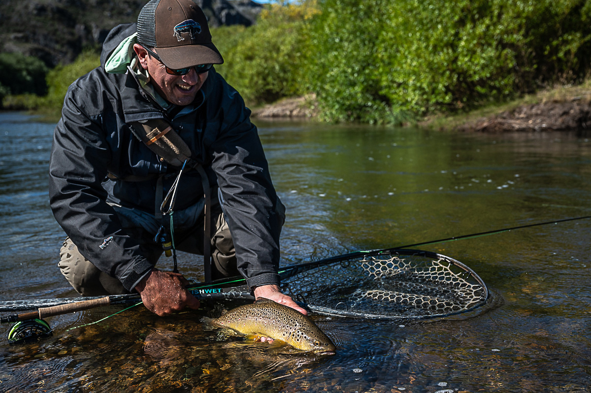 Las Pampas fly fishing guide Nico Alvrez with a Rio Pico brown trout.