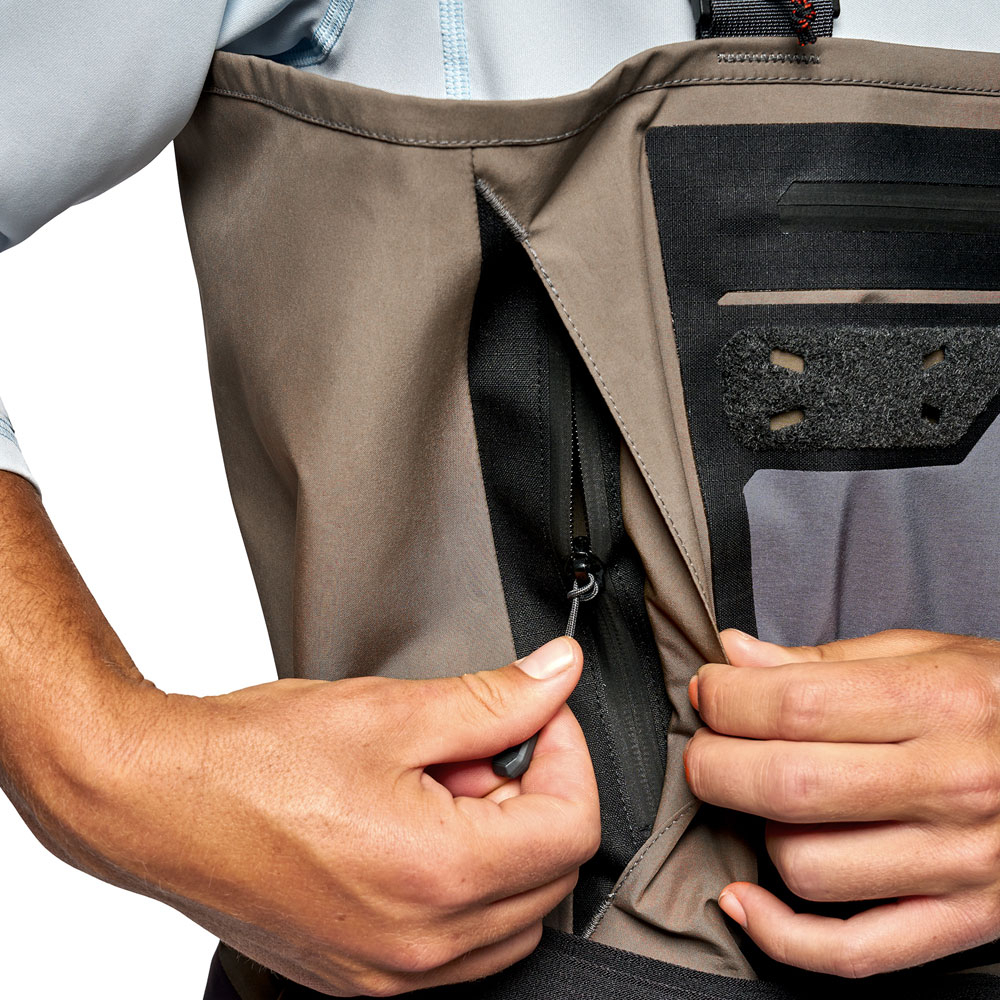Zippered passthrough handwarmer pockets with upgraded micro-fleece for enhanced warmth and quick dry time for wet hands.