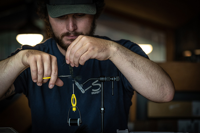 Beginner fly tying students tying flies at the Silver Bow Fly Shop.