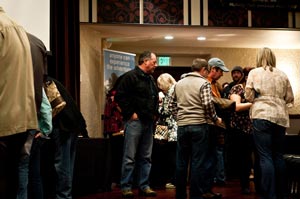 Participants at our Wild Steelhead Coalition Benefit purchase tickets and talk to vendors.