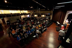 The crowd listens for their numbers to be drawn for the raffle prizes.