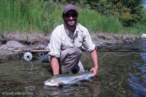 Bo breaking in his new Nautilus CCF on a Clearwater River steelhead in late summer.