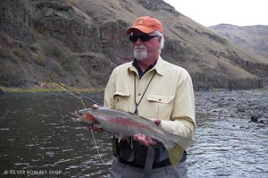 Fay holding a steelhead with a hell-of-a-tail from the Grande Ronde.