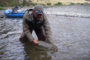 Josh releasing a nice bright early hen during September on the Grande Ronde near Oregon.