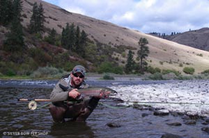 Josh releasing a nice buck he caught moments after the nice bright hen on the Grande Ronde.