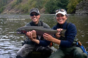 Dorie and Sean celebrating her first Grande Ronde River Steelhead with big smiles.