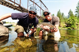 Brad and Sean from Silver Bow with a nice rainbow trout from the Spokane River.