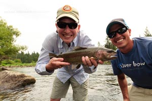 Spencer Williams and Spokane fly shop owner Sean Visintainer with a nice fly caught rainbow trout.