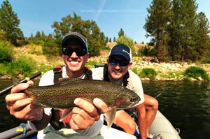 Sean holding a Redband Rainbow Trout from the Spokane River his dad Jon caught on a Winston Fly Rod.