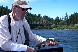 Bill getting his day started right with a fine little Spokane River Redband Rainbow.