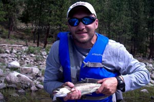 A client taking a break from work in Spokane to join us on a fly fishing trip down the river.