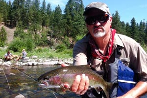 Felix is all business with a healthy Spokane trout caught nymphing during the summer.