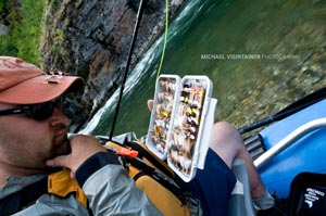 Britten Jay rummaging through his box of dry fly treats for cutthroat in Idaho's Panhandle on the St. Joe.