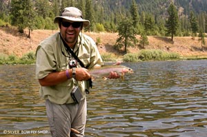 Silver Bow guide Britten Jay enjoying a summer day on the Clark Fork River whacking rainbows.