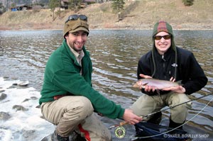 Bo and Spencer posing in some goofy fishing hats and a nice cuttbow from the Clark Fork River.