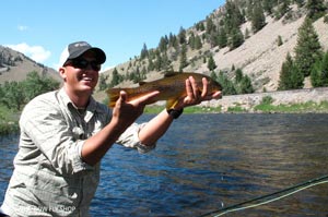 Sean, owner of Silver Bow, giving the hero shot to the camera with a Big Hole brown.