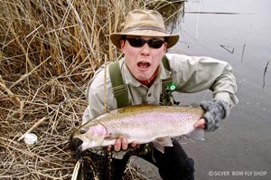 Josh K. beside himself with a fatty Rocky Ford Rainbow in Central Washington.